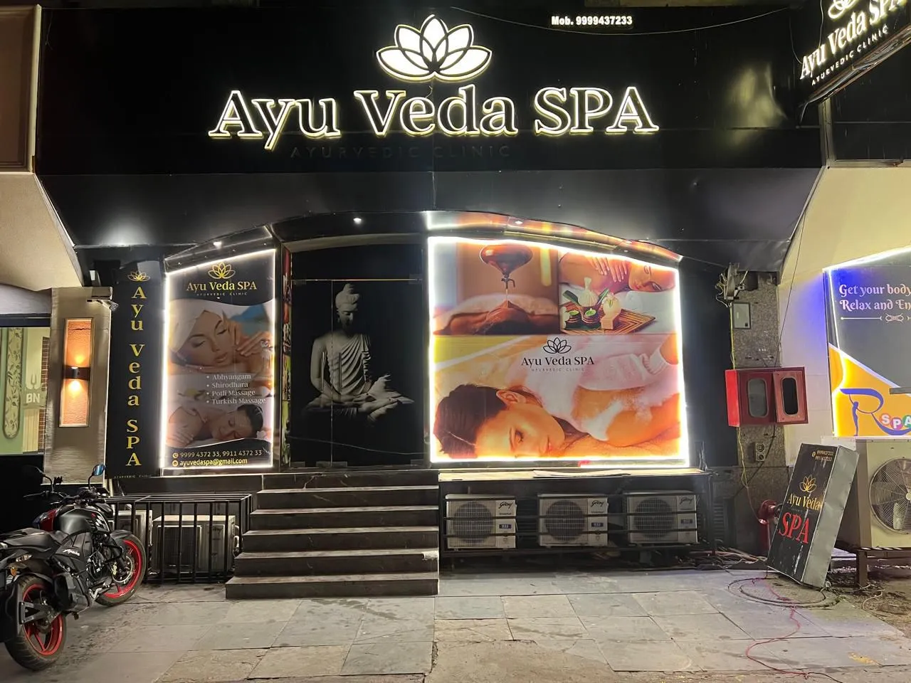 Ayu Veda Spa storefront at night